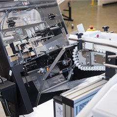 A custom integrated poly bag solution using conveyor belts.