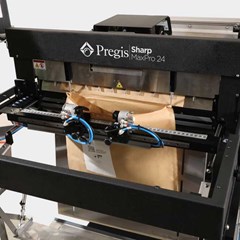 Image of a Pregis Sharp MaxPro 24 bagging machine with an Evertec Mailer in process.